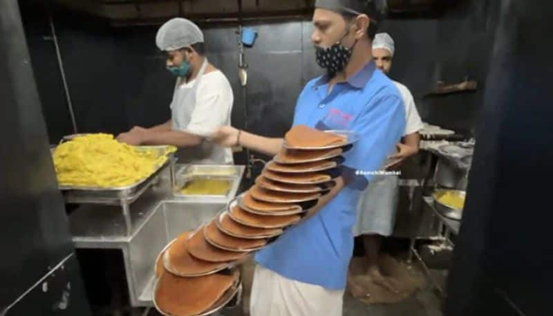 Waiter Balances 16 Plates Of Dosa On hand azn