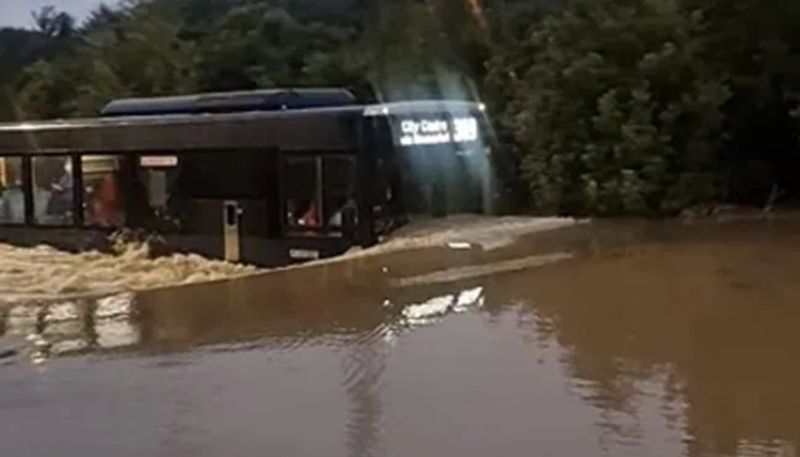 bus moving through flood water 