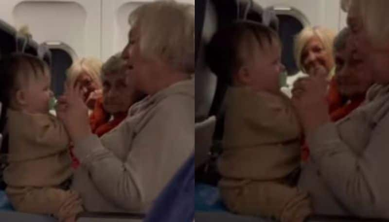 3 elderly women help mother after her toddler starts screaming on flight azn