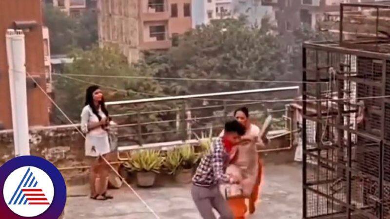 Desi Mom Catches Daughter With Boyfriend On Terrace, Beats Them With Slipper Vin