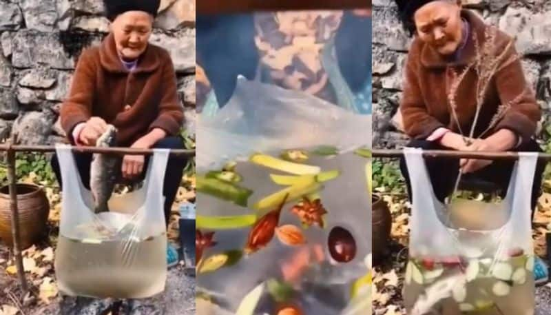 Woman Cooks Fish Broth In A Plastic Bag  azn 