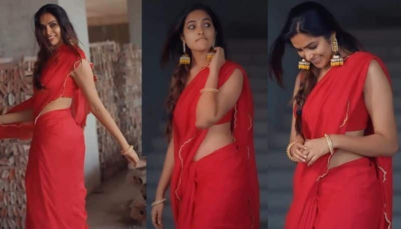 Actress Divi beautiful look in red saree and stunning poses