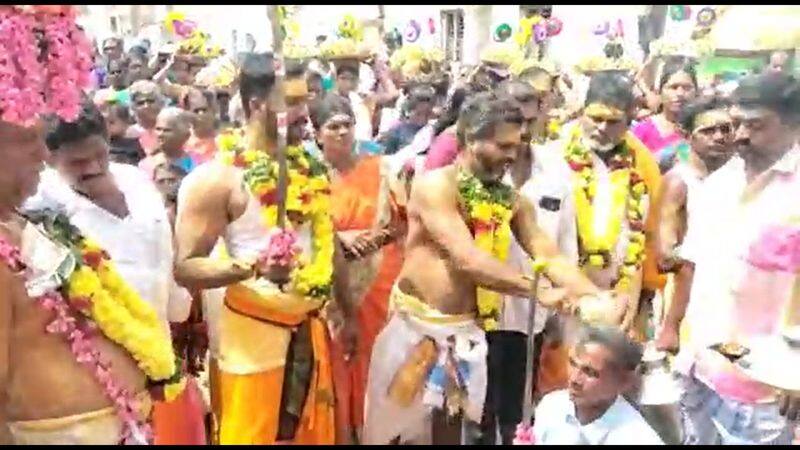 Hundreds of devotees break coconuts on their heads at the Salem Temple Festival