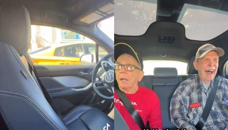 old mens hilarious expressions while having ride in self driving car hyp 