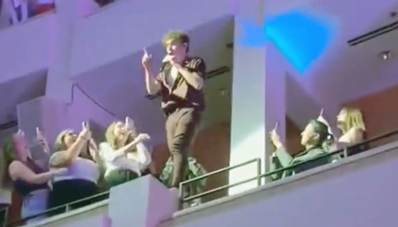 singers adventure performance on live show by climbing over balcony railings hyp