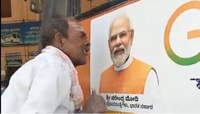 Karnataka farmer kisses PM Modi photo on bus; says he will conquer the world