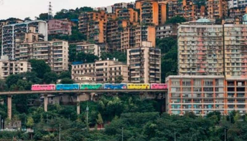 Train runs through middle of the apartment in China