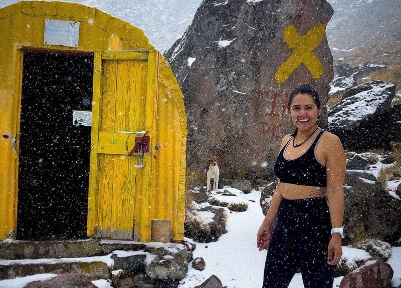 This woman is living atop a snow-covered volcano to break a record. Read her story