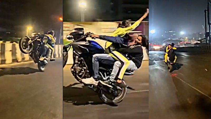 wheeling in bike with two girls video goes viral Mumbai youth arrested akb