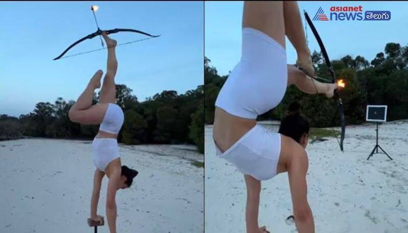 Gymnast shoots flaming arrow with her feet after 17 years of training. Twitter is speechless ram 