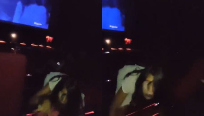 woman acts like possessed inside theatre during a horror movie trailer release hyp 