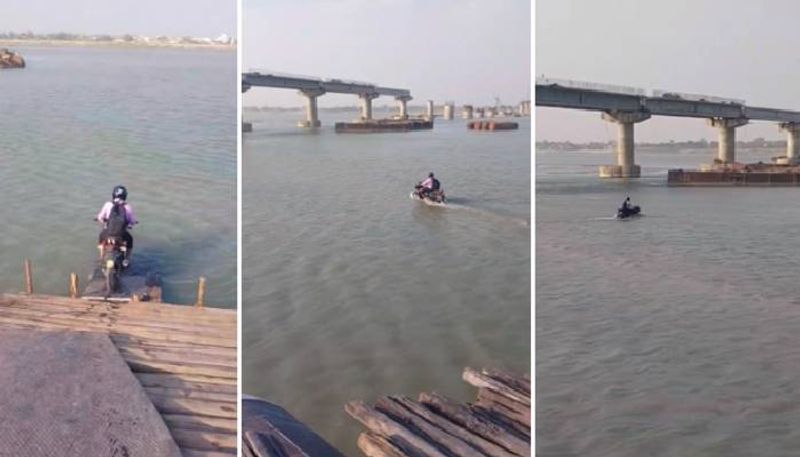 man riding bike in river rlp