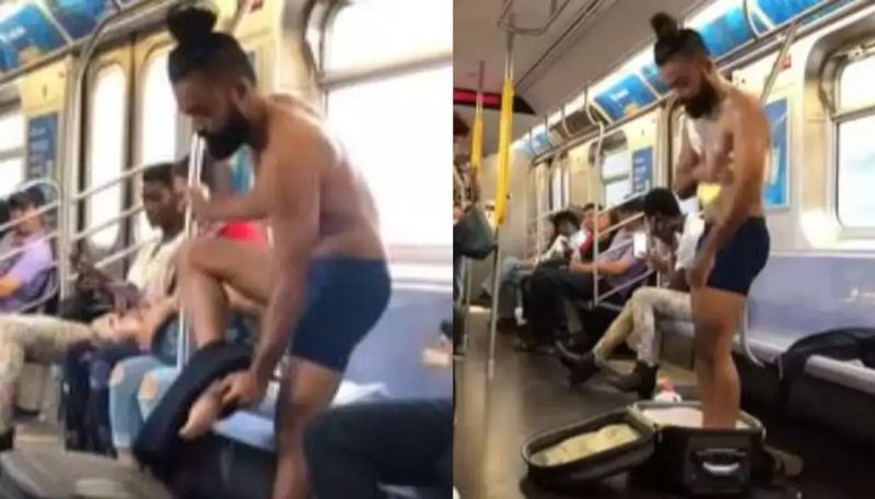 man removes cloths and takes bath inside moving train hyp 