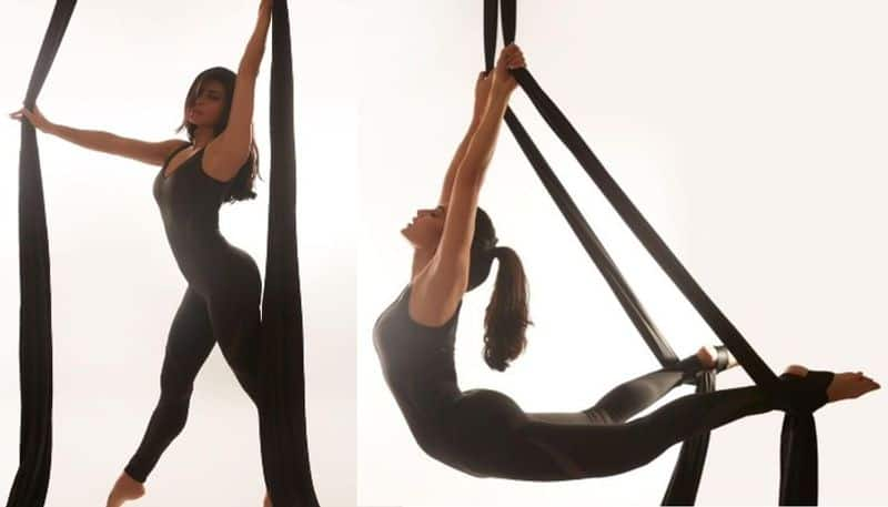 Bollywood Actress Jacueline Fernandez attractss with her Aerial Yoga poses NSK