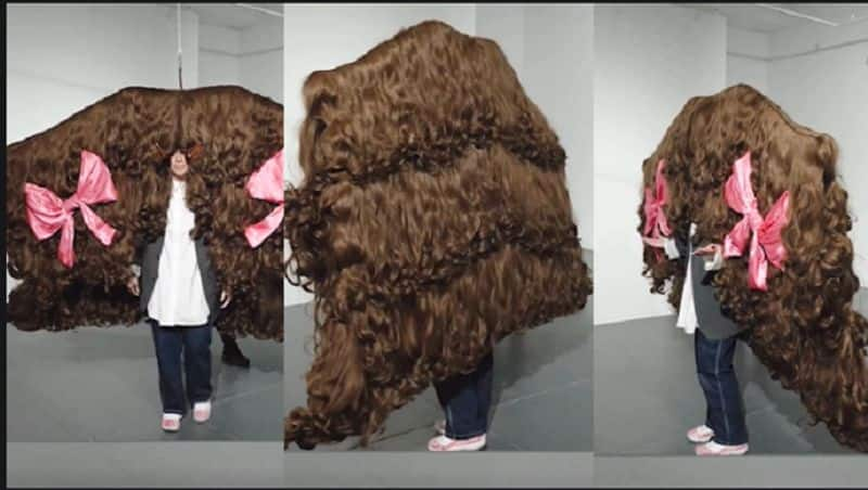 An Australian woman holds a world record for making the largest wig akb