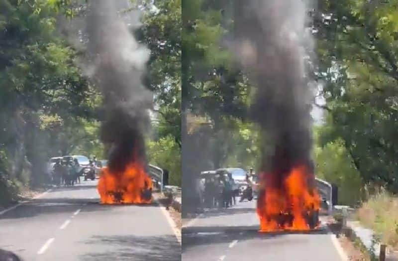 suddenly a car caught fire in the middle of the road while traveling to yercaud