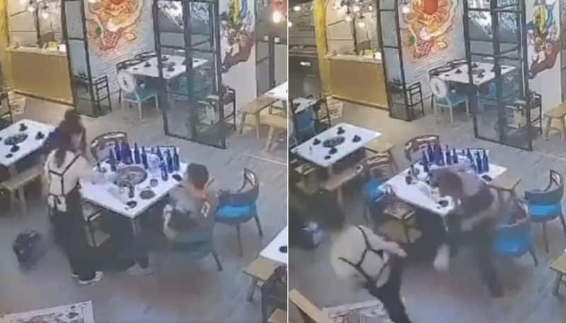 women fights with two men in a restaurant hyp