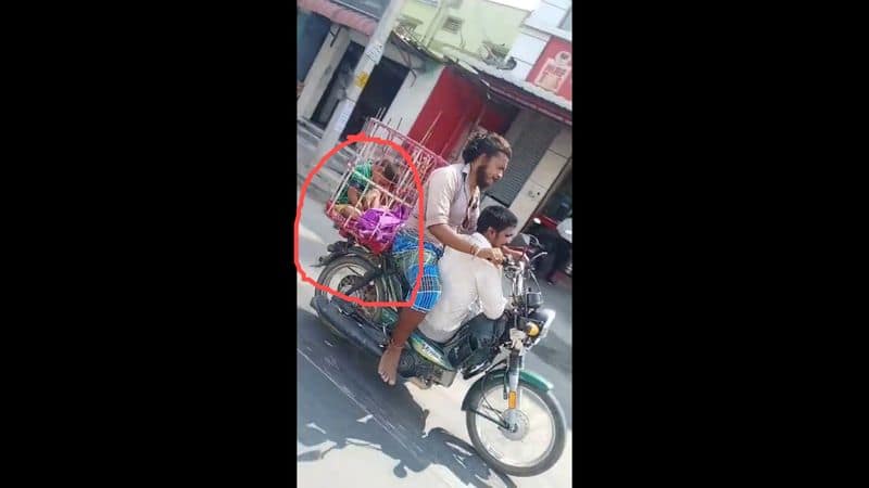 young man travelling with child in two wheeler video goes viral