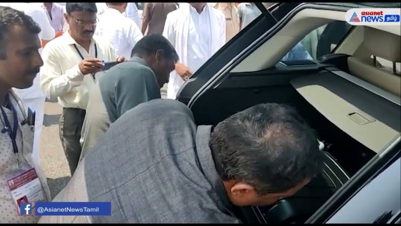 Election officials check the helicopter carrying Karnataka Congress leaders family