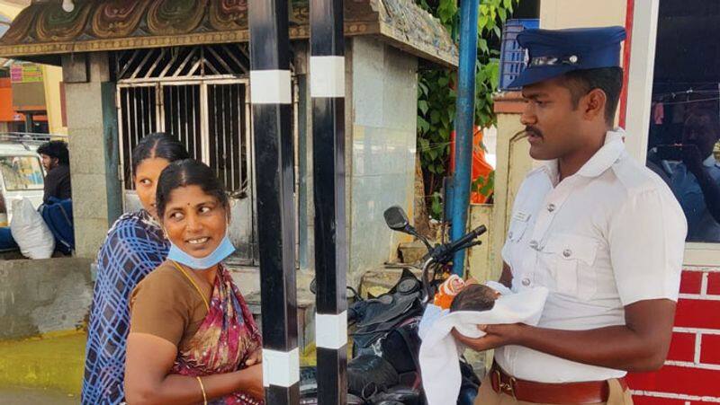 The traffic police who carried the baby in his arms, helped the young woman to relax at coimbatore