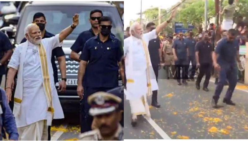 Video emerges of SPG official intercepting mobile phone flung towards PM Modi during Kochi roadshow ppp