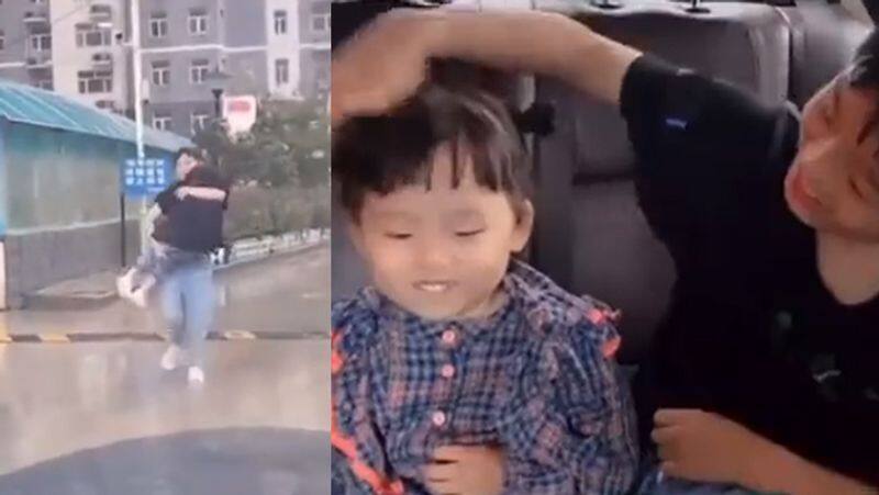 Big brother protects little sister from rain in super cute viral video rsl