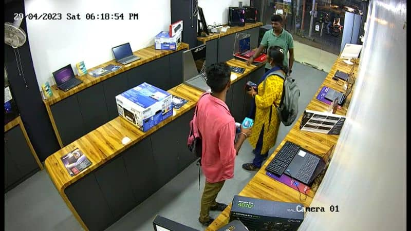 young lady try to theft laptop in showroom in coimbatore