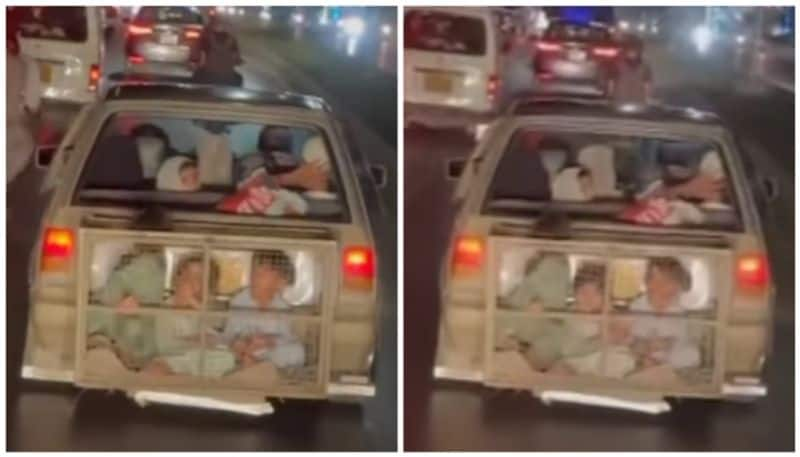 viral video of three children in a cage attached with car bkg 