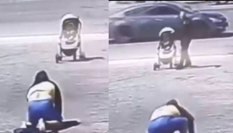 man saves baby in stroller in road rlp