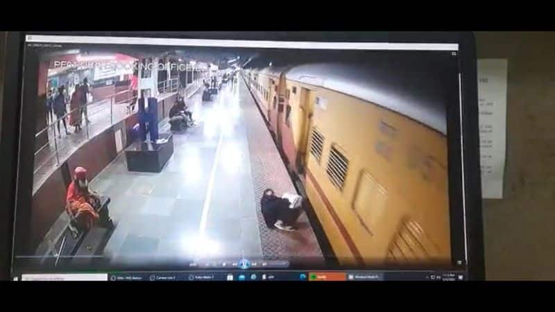 railway police rescue a passenger who fall down from train in salem railway station