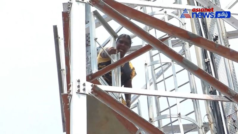 55 year old woman did a protest in 120 feet cell phone tower continuously 4 hours in karur district