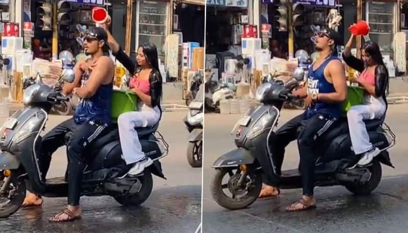 Man And Woman take Bath On a Scooter azn 