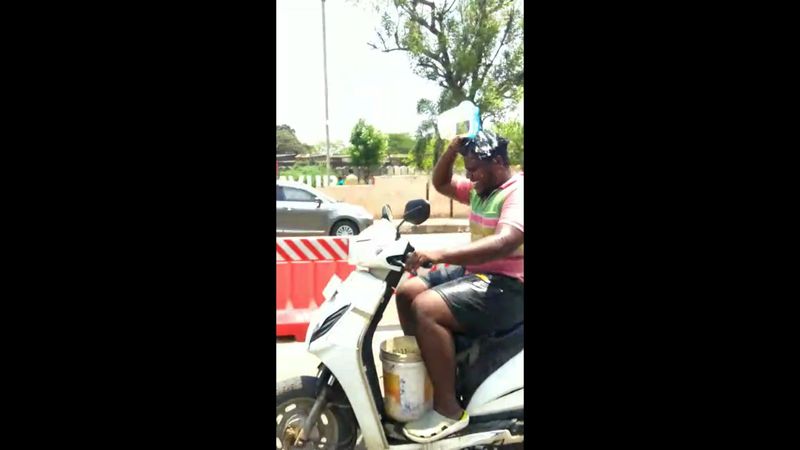 Fined for riding bike while taking bath in Thanjavur