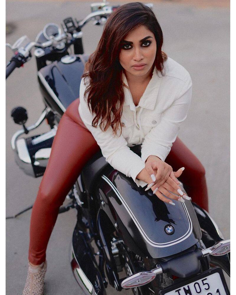 Shivani posed for a photo shoot sitting on a BMW bike