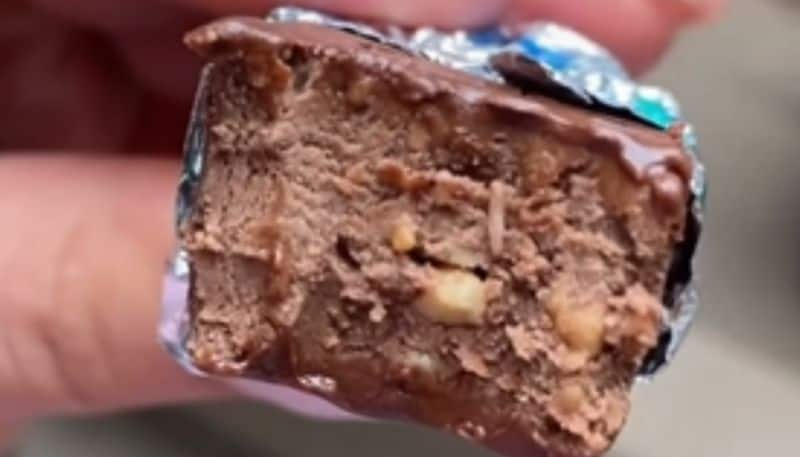 Woman Finds Worm Crawling Out Of Her Half eaten Chocolate Bar azn 