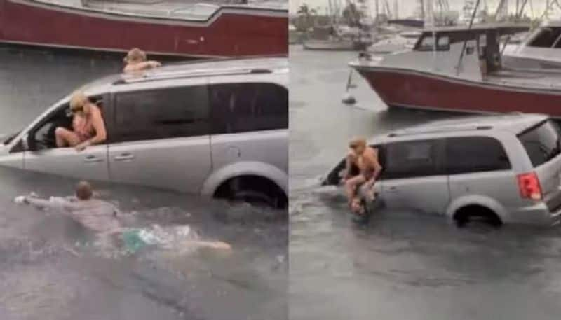 Drunk women  who drives a car while looking at GPS and drives it into the sea: Video goes viral