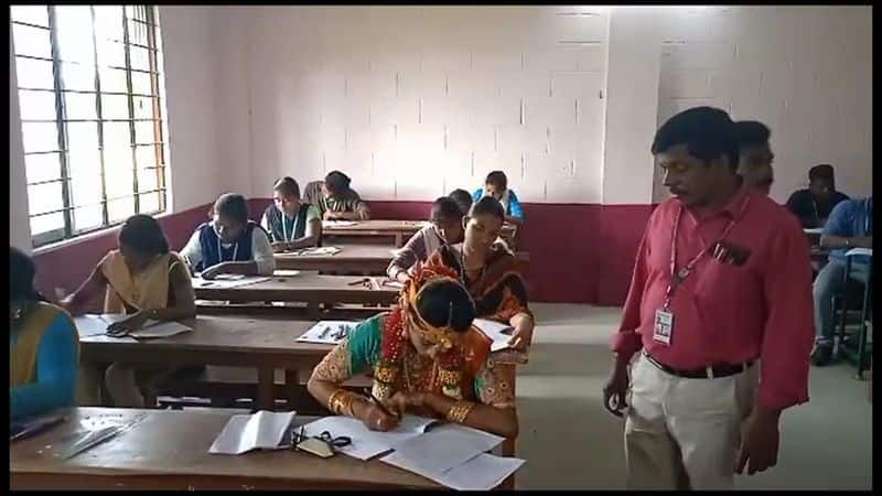 newly married woman write a semester exam with marriage getup in nagapattinam