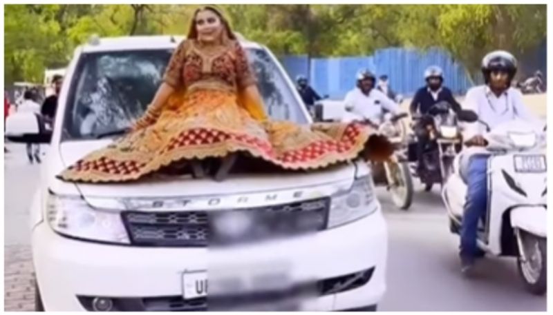 Police fined for sitting on bonnet of SUV and shooting wedding reel bkg 