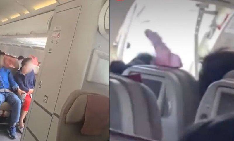 WATCH Dramatic video shows passengers of Asiana Airlines plane terrified as emergency door opens midair 