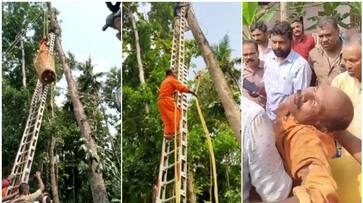 Man got stuck tree while cutting tree at Pathanamthitta, Kerala Fire Force Rescue Services asd Man got stuck tree while cutting tree at Pathanamthitta, Kerala Fire Force Rescue Services asd