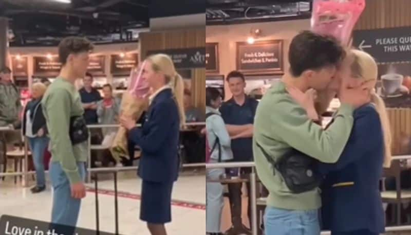 man proposes his air hostess girlfriend at airport hyp 