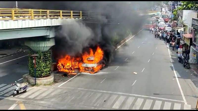 A car is burning under the Adyar flyover in chennai