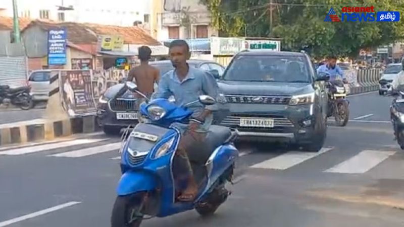 A half-naked man in the middle of the road blocking the vehicles near Pollachi 