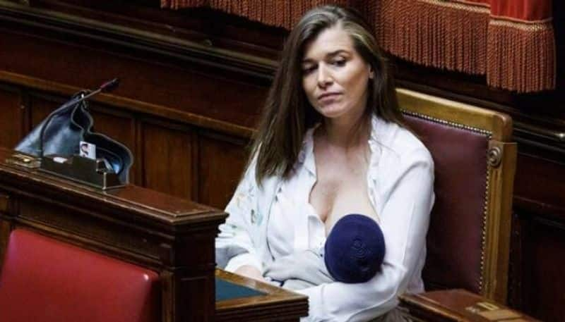 lawmaker breastfeeding baby inside italian parliament hyp 