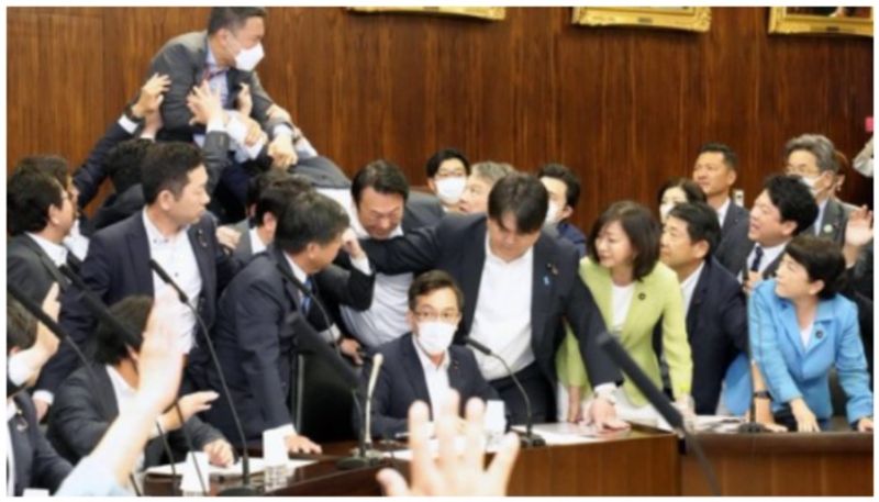 battle royale inside japanese parliament over anti refugee bill bkg 