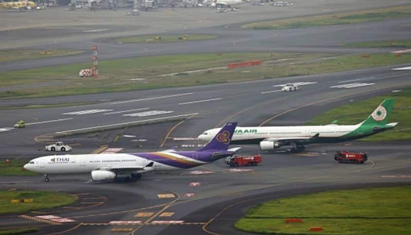 Two planes Thai airways and Taiwan's Eva airways collide on ground at Tokyo's Haneda airport; Passengers safe anr