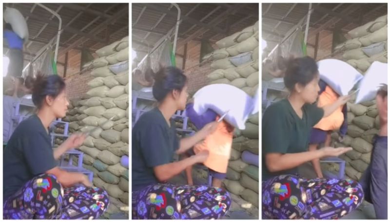 woman quality inspection on rice bags in viral video bkg