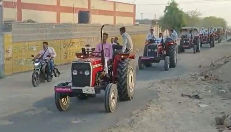 groom drives to brides home with 51 tractors hyp 