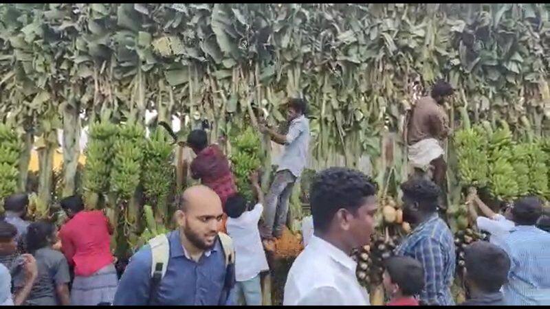 People carrying decorations at a function attended by Chief Minister Stalin in Tiruvarur