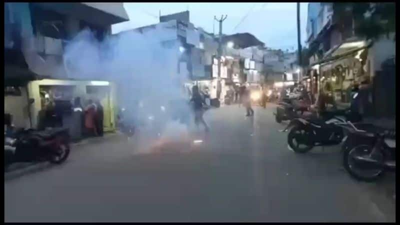 500 Tasmac shops to close from today People celebrating by bursting firecrackers in front of the shop